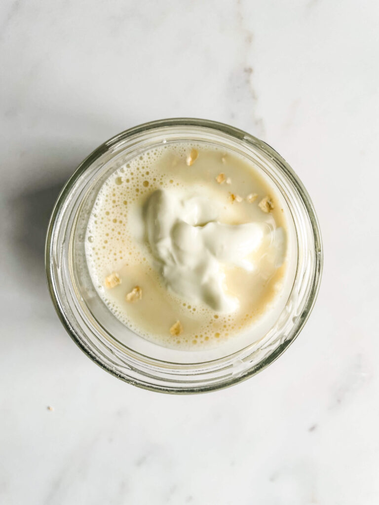 Jar with yogurt, milk and oats