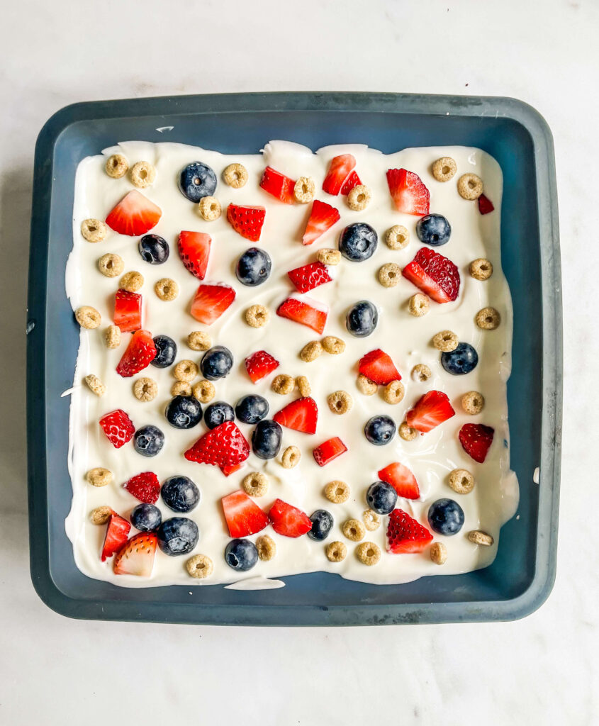 yogurt and berries in a baking tray